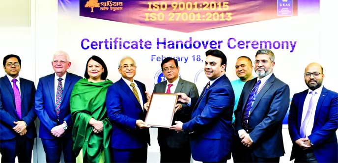 Tapan Chowdhury, Sponsor and Patron of Guardian Life Insurance Limited (GLIL), receiving the ISO 9001:2015 and ISO 27001:2013 certificates from Rashid M Akhter, Managing Director of ISO QAR Bangladesh at GLIL head office in the city on Tuesday. High offic