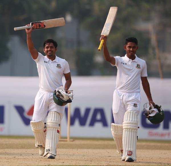 Al-Amin and Tanzid Hasan of BCB XI, celebrating their centuries against Zimbabwe Cricket team in their two-day practice match on the second and final day at BKSP Ground in Savar on Wednesday.