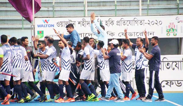 Members of Bangladesh Navy, the champions in the Bangabandhu Shaheed Smrity Hockey Tournament celebrating after defeating Bangladesh Army in the final at the Maulana Bhashani National Hockey Stadium on Thursday.