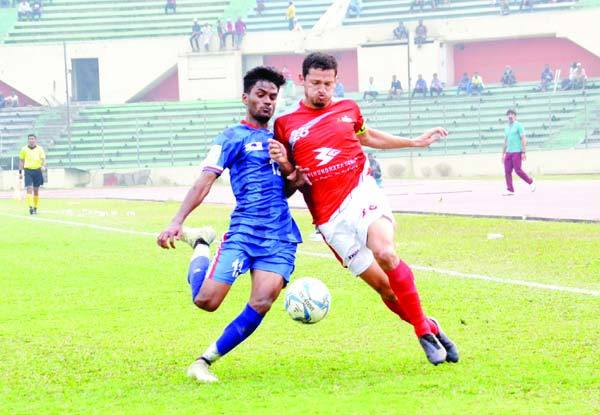 An action from the match of the Bangladesh Premier League Football between Bashundhara Kings and Bangladesh Police Football Club at the Bangabandhu National Stadium on Thursday. The match ended in a 1-1 draw.