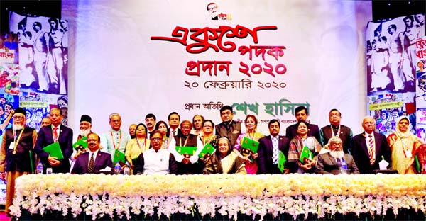 Prime Minister Sheikh Hasina poses for photograph with the recipients of Ekushey Padak 2020 at the Osmani Memorial Auditorium in Dhaka on Thursday.