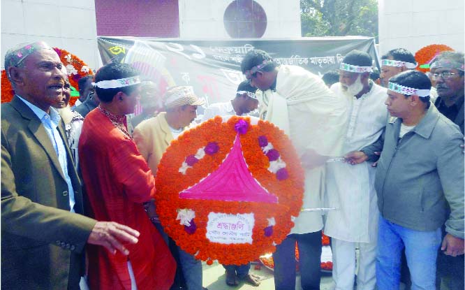 SUNDARGANJ (Gaibandha): Barrister Shameem Haider Patwary placing wreaths at the Central Shaheed Minar at Sundarganj Upazila in the occasion of the International Mother Language Day on Friday.
