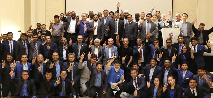 Ahsan Khan Chowdhury, Chairman and Chief Executive Officer of PRAN-RFL Group, poses for photo session with the participants of its Importersâ€™ Conference at Dubai recently. Importers from more than 80 countries participated in the program.