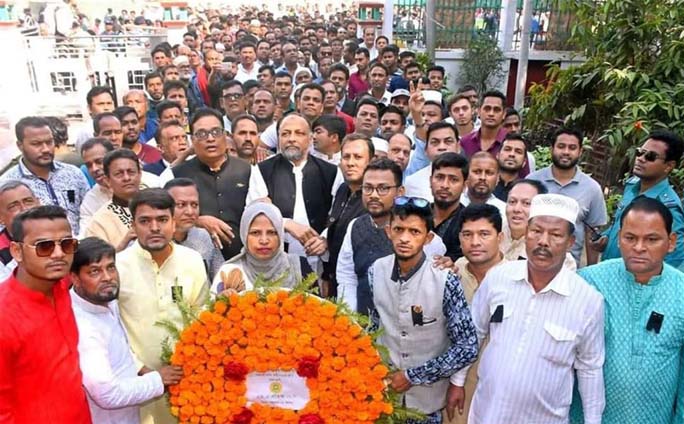 M A Latif MP with other leaders of Awami League placing wreaths at the Shaheed Minar marking the International Mother language Day on Friday.