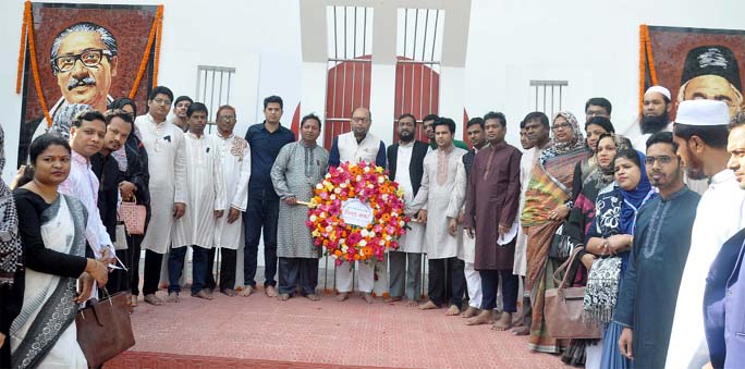 Students and teachers of Kazim Ali School and College placing wreaths at the Shaheed Minar in observance of the International Mother Language Day on Friday.