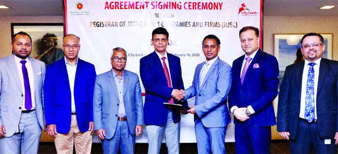 Sheikh Mohammad Maroof, AMD of City Bank Limited and Md. Zakir Hossain, Registrar of Joint Stock Companies and Firms (RJSC), exchanging document after signing an agreement at the bank's head office in the city recently. Under the deal, the bank will be f