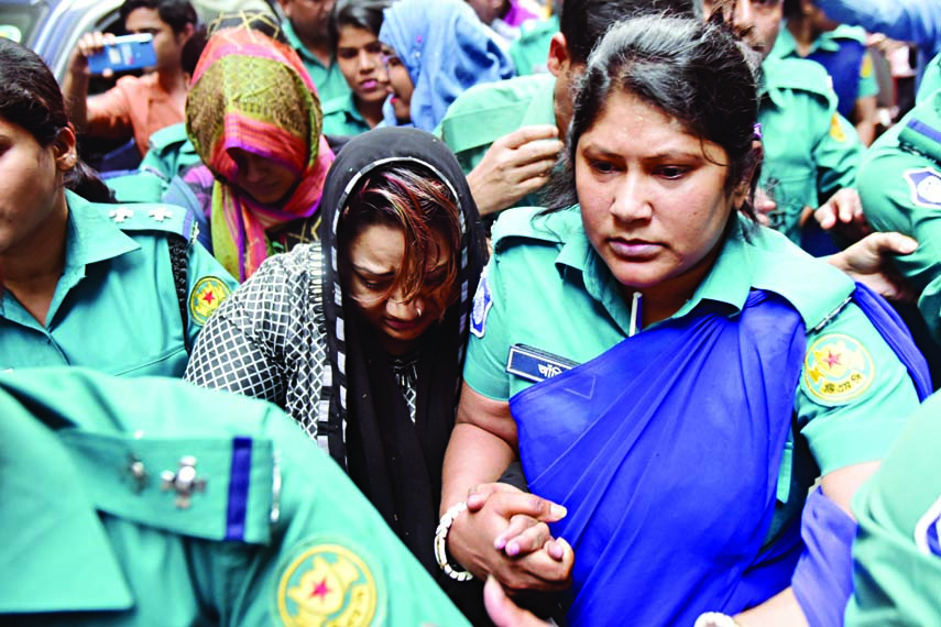 Police produce expelled Jubo Mohila League leader Shamima Nur Papiya before a Dhaka court on Monday in connection with three cases filed against her by RAB with two police stations in city.