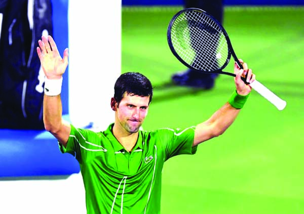 Serbia's Novak Djokovic greets the public after defeating Tunisia's Malek Jaziri during round 1 of the Dubai Duty Free Tennis Championships in the United Arab Emirates on Monday.