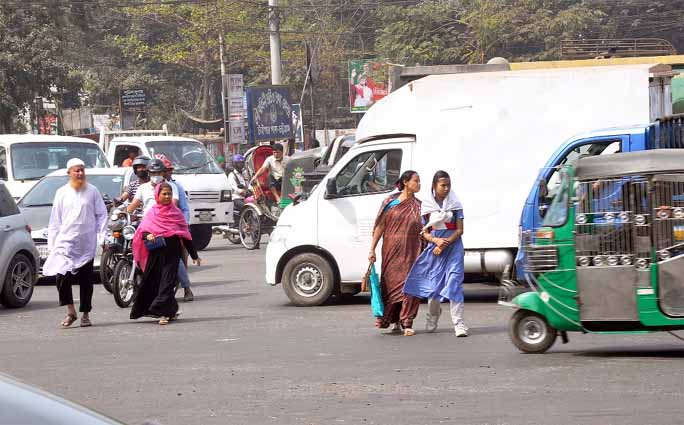 People at Tiger Pass area in Chattogram City crossing road risking life though there are Zebra-crossing available. This picture was taken yesterday.