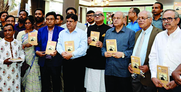State Minister for Information Dr.Murad Hasan along with others holds the copies of a book titled 'Epic of March 7' written by Prof Dr. Uttam Kumar Barua at its cover unwrapping ceremony at the Ekushey Book Fair in the city's Suhrwardy Udyan on Wednesd