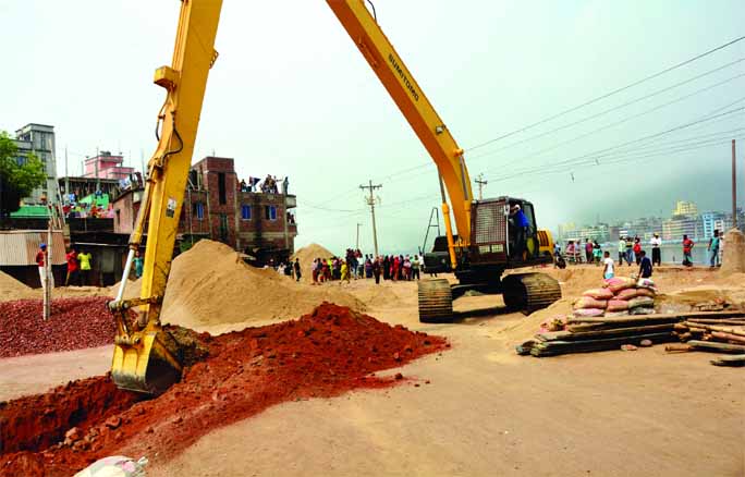 Bangladesh Inland Water Transport Authority (BIWTA) evicting illegal establishments and illegal sand traders on the bank of Buriganga River. This photo was taken from Hasnabad area in Keraniganj on Wednesday.