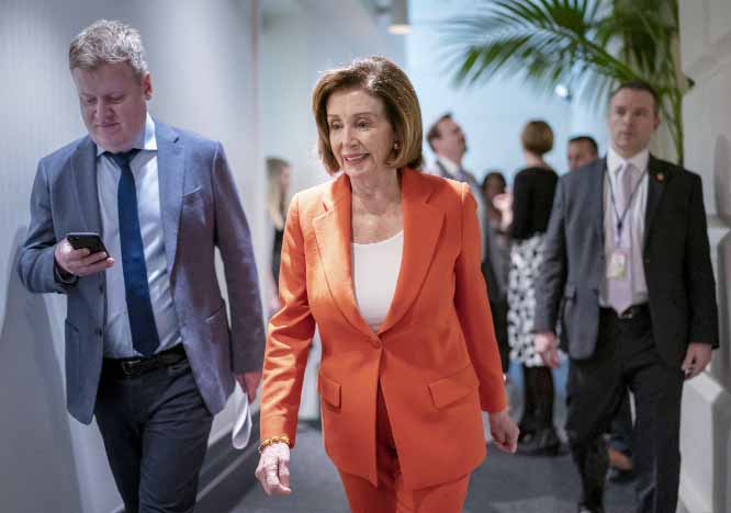 Speaker of the House Nancy Pelosi, D-Calif., arrives for a meeting with fellow Democrats on Capitol Hill in Washington on Wednesday.