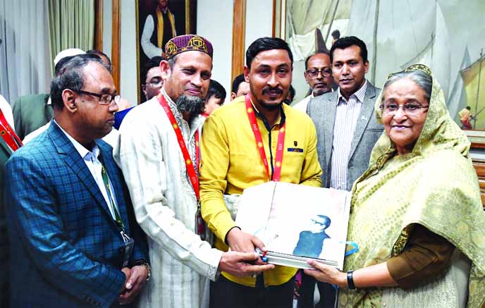 Prime Minister Sheikh Hasina unveiled the cover of a book titled "Keno Tini Jatir Pita" (Why he is Father of the Nation) at Ganobhaban in the city on Tuesday. Prof Dr M Nazrul Islam, Dr Kudrat-E-Khuda and Minar Masud wrote the book while M Rasel Molla B