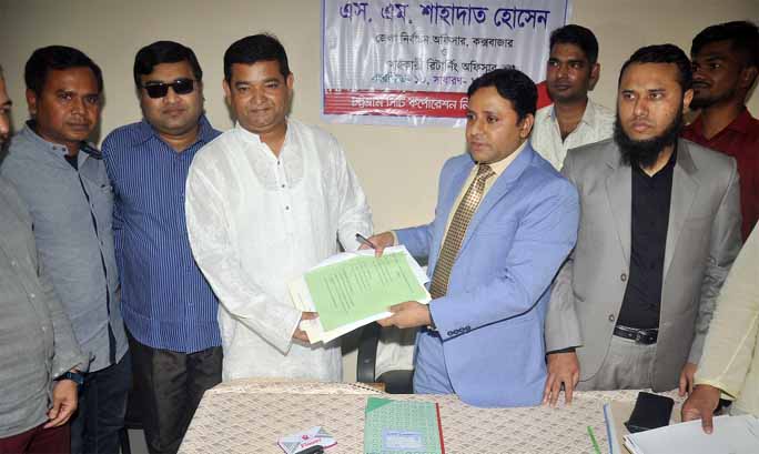 Awami League nominated councillor candidate Abdus Sabur Liton submitting nomination paper for councillor of Ward No 25 in CCC election on Friday.