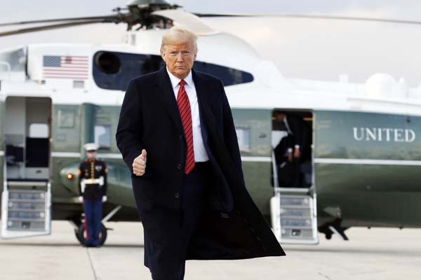 President Donald Trump boards Air Force One from Andrews Air Force Base, Md., on Friday en route to North Charleston, S.C., for a campaign rally.