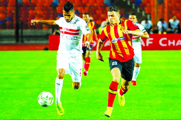 Mohamed Ounajem (left) of Zamalek fights for the ball with Ilyes Chetti of Esperance in their quarter-final match of the CAF Champions League at Cairo in Egypt on Friday.