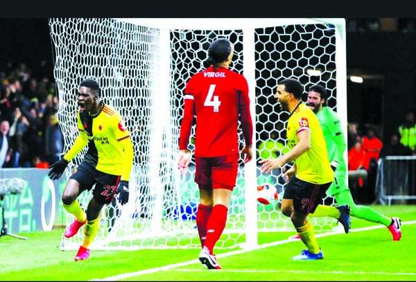 Watford's Ismaila Sarr (left) runs off in celebration after scoring against Liverpool on Saturday.