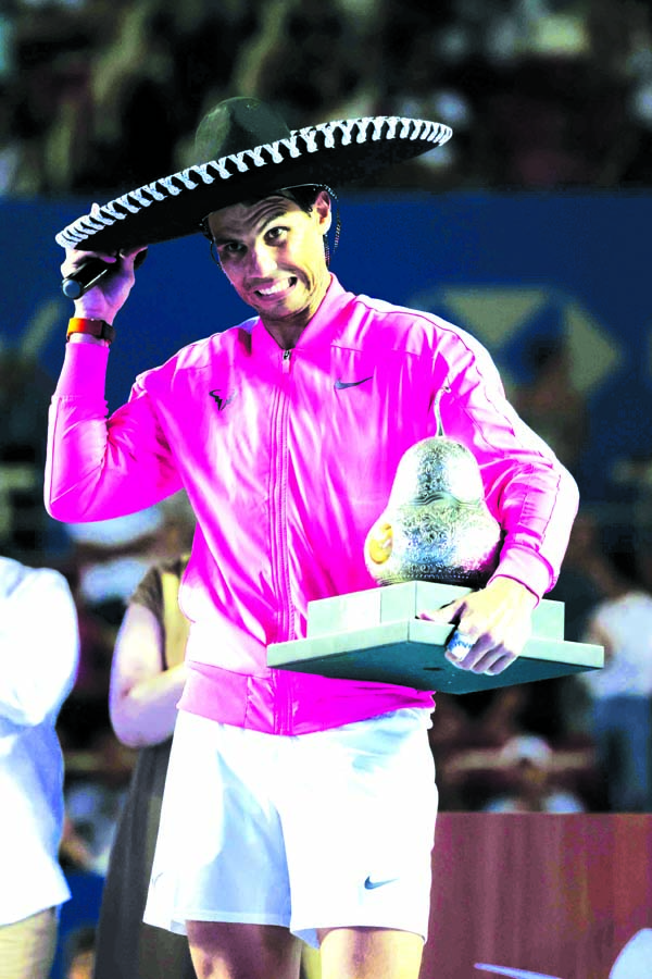 Spain's Rafael Nadal adjusts his sombrero as he receives his trophy after defeating Taylor Fritz of the United States, 6-3, 6-2 in the men's final of the Mexican Open tennis tournament in Acapulco of Mexico on Saturday.