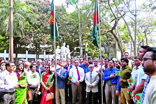 Vice-Chancellor of Dhaka University Prof. Dr. Md. Akhtaruzzaman along with other teachers at the flag hoisting ceremony at the foot of Aparajeya Bangla of the university on Monday marking the historic Flag Hoisting Day.