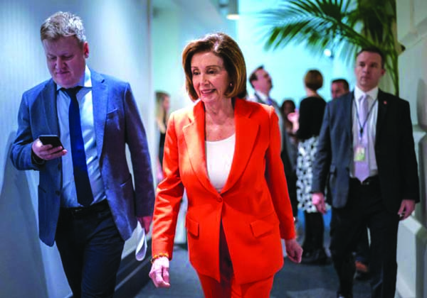 Speaker of the House Nancy Pelosi, D-Calif., arrives for a meeting with fellow Democrats on Capitol Hill in Washington on Wednesday.