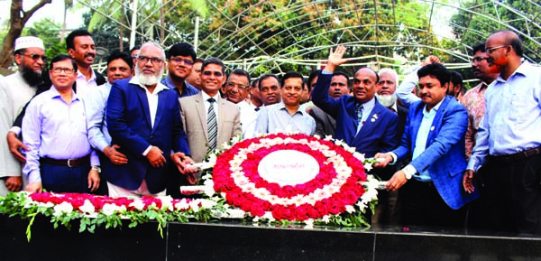 Newly appointed Chief Engineer of LGED Md. Matiar Rahman along with other officials and employees paying tributes to Bangabandhu placing floral wreaths on the portrait of Bangabandhu in the city's 32, Dhanmondi on Wednesday.