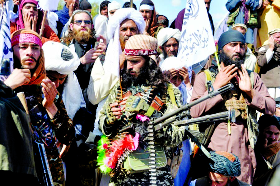 Afghan Taliban fighters and villagers attend a gathering in Alingar district of Laghman Province on the day the militants said they were resuming operations against Afghan government targets. Internet photo