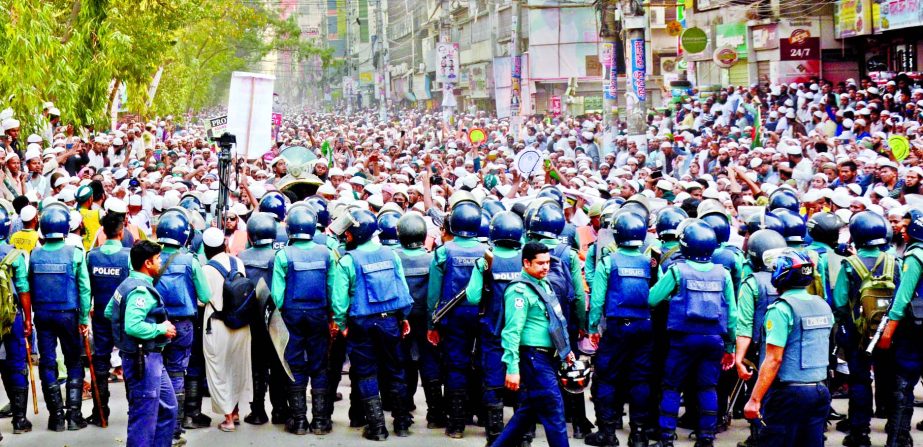 Police intercept an Islami Andolan Bangladesh (IAB) procession at Naya Paltan in Dhaka on Wednesday on its march towards the Indian High Commission. The IAB organised the procession protesting against the repression on Muslims in India.