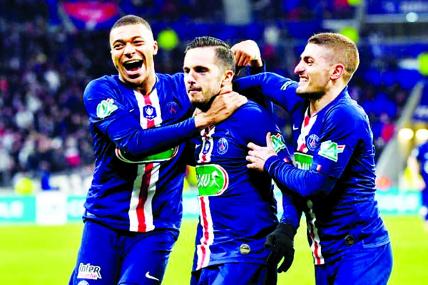 Paris Saint-Germain's Spanish midfielder Pablo Sarabia (centre) is congratulated by Paris Saint-Germain's French forward Kylian Mbappe (left) and Paris Saint-Germain's Italian midfielder Marco Verratti after scoring a goal during the French Cup semi-fi