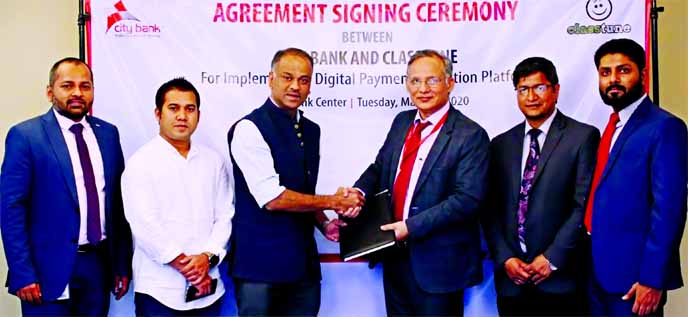 Md. Zafrul Hasan, Head of Digital Financial Services of City Bank Limited and Russell T Ahmed, Founder & CEO of ClassTune, exchanging an agreement signing document at the bank head office in the city on Tuesday to implement digital payment collection plat