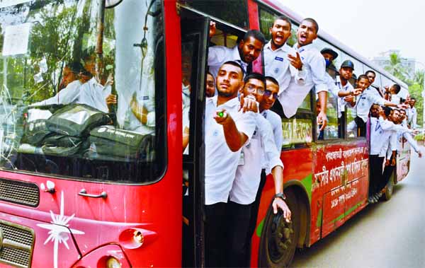 Students of Dhaka College travelling on a bus risking their lives on Thursday. This snap was taken from TSC intersection.