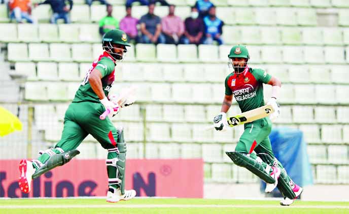 Tamim Iqbal (left) and Liton Das running between the wickets during the third and final ODI cricket match between Bangladesh and Zimbabwe at Sylhet International Cricket Stadium on Friday.