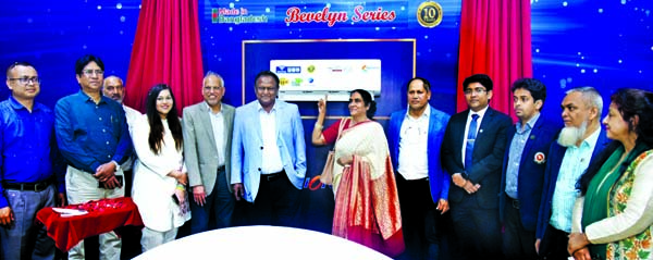 Commerce Minister Tipu Munshi poses for a photo session before unveiling Walton's new models of AC and 55-inch 4K TV at Hi-Tech Industries Limited (WHIL) at Chandra in Gazipur on Saturday. Commerce Secretary Dr Md Jafar Uddin, WHIL Chairman SM Nurul Alam