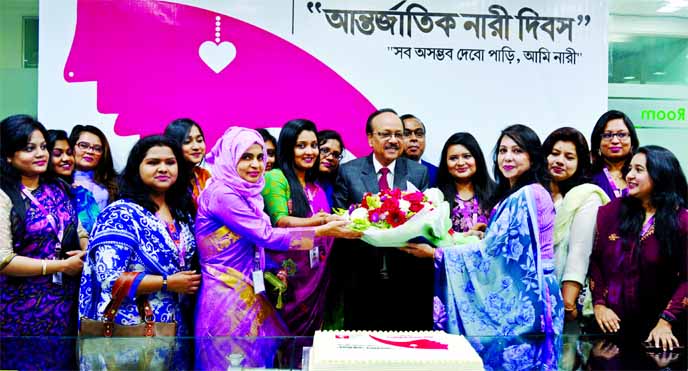Md. Ehsan Khasru, CEO of Padma Bank Limited, greeted the female officers with flowers marking the International Women's Day at the banks head office in the city on Sunday. Md. Shahadat Hossain, Chief Operating Officer, Sabirul Islam Choudhury, Head of Re