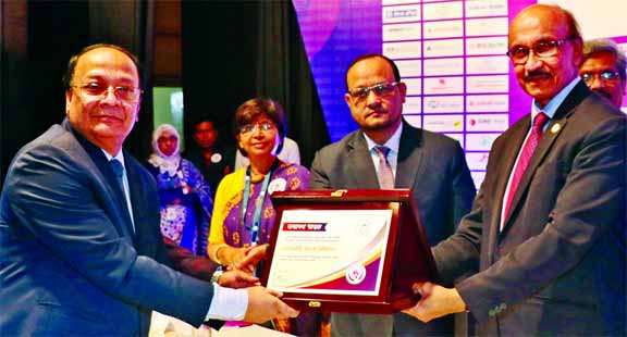 M. Kamal Hossain, Managing Director of Southeast Bank Limited, receiving the first prize for its outstanding contribution to finance in the Cottage, Micro, Small and Medium Enterprise (CMSME) under financial inclusion activities from Bangladesh Bank (BB)