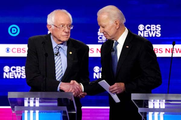 Senator Bernie Sanders (left) shaking hands with former vice-president Joe Biden after the 10th Democratic 2020 presidential debate