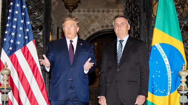 President Donald Trump speaks before a dinner with Brazilian President Jair Bolsonaro at Mar-a-Lago on Saturday in Palm Beach, Fla.