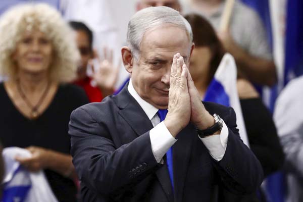 Israeli Prime Minister and head of the Likud party Benjamin Netanyahu reacts after delivering a statement in Petah Tikva on Saturday.