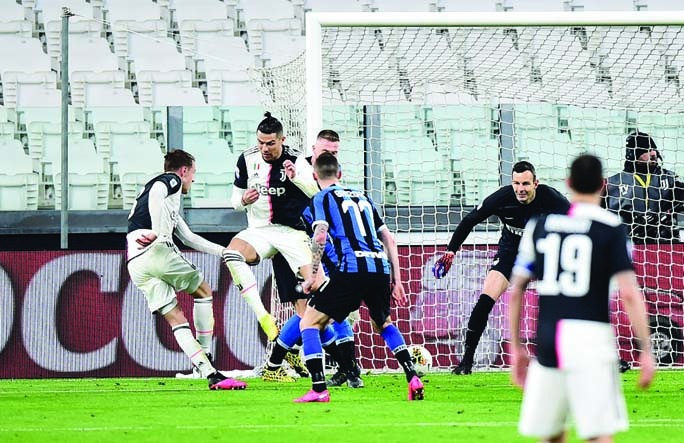 Juventus' Aaron Ramsey (left) scores their first goal against Inter Milan at the Allianz Stadium in Turin on Sunday.