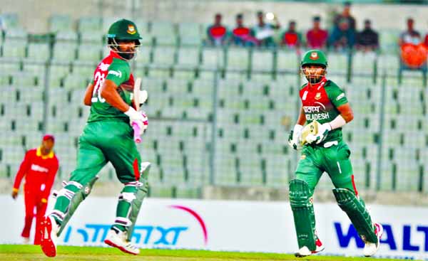 Tamim Iqbal (left) and Liton Das running between the wickets during the T20I cricket match between Bangladesh and Zimbabwe at the Sher-e-Bangla National Cricket Stadium in the city's Mirpur on Monday.