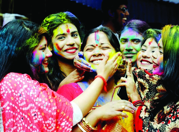 BOGURA: Young girls at Chelopara celebrating Dol Purnima Festival on Monday.