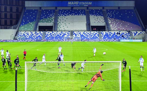 A view of the empty stands at the Mapei Stadium as the Serie A soccer match between Sassuolo and Brescia is being played behind closed doors, in Reggio Emilia on Monday. Italian Premier Giuseppe Conte says he is restricting travel nationwide to try to st