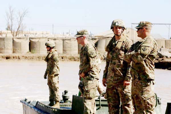 US troops supervise a training session at the Taji camp, north of Baghdad - the site of the Wednesday night rocket attack.