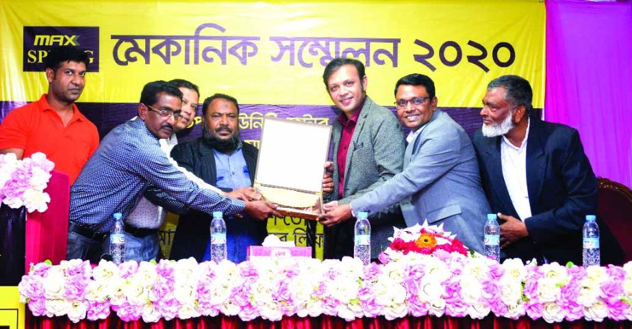 Kazi Yaminur Rashid Turjo, CEO, Industrial Division of MAX Group, handing over a crest to a mechanic at Mechanic Conference of MAX Spring (a product of Max Group) at a hotel in Bogura recently. More than five hundred mechanics from the North Bengal region