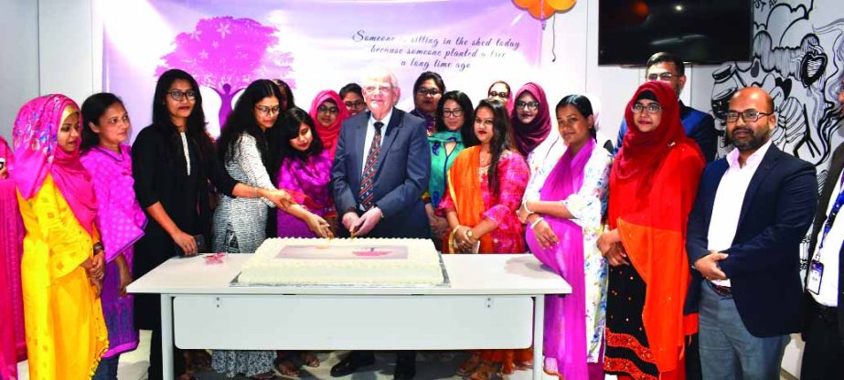 David James Howard Griffiths, Director of Guardian Life Insurance Company Limited celebrates the International Women's Day-2020 by cutting a cake at its head office in the city recently. Female employees and high officials of the company were also presen