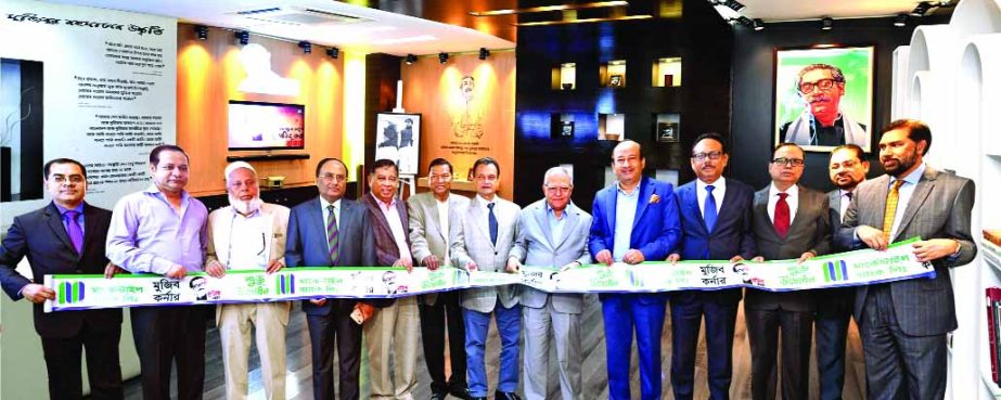 Morshed Alam M.P, Chairman of Mercantile Bank Limited, inaugurating the 'Mujib Corner' by cutting ribbon at the banks head office in the city on Thursday. Mohd. Selim, Vice Chairman, Md. Anwarul Haque, EC Chairman, A S M. Feroz Alam, A.K.M. Shaheed Reza