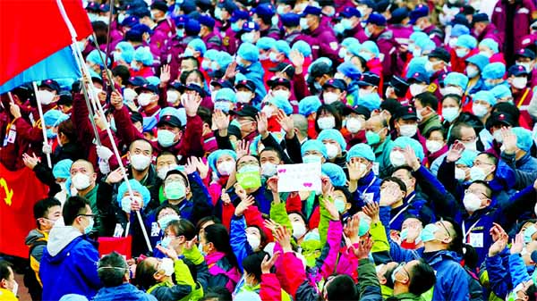 Medical workers celebrate the shutting down of Jianghan Fangcang temporary hospital for COVID-19 patients in Wuhan as the number of patients drops.