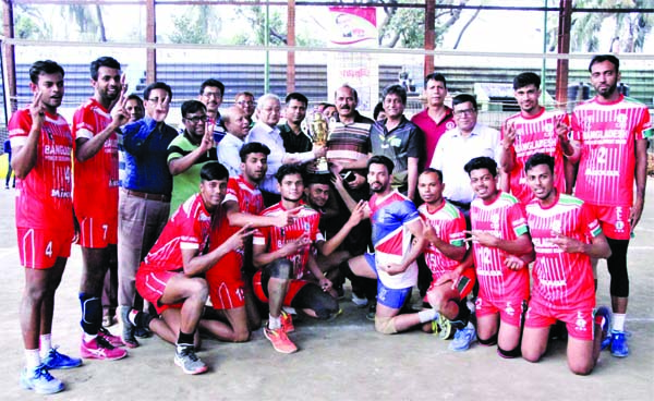 Bangladesh Power Development Board team, the champions in the qualifying round (associations zone) of the Bangabandhu Bangladesh Games with the guests and officials of Bangladesh Volleyball Federation pose for photograph at the Shaheed Nur Hossain Nationa