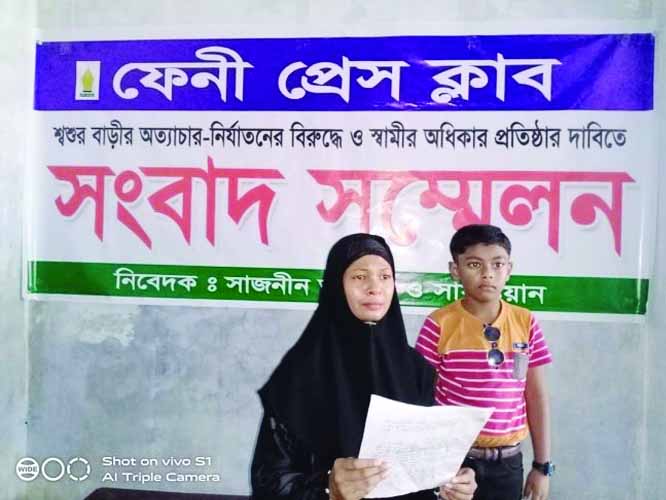 FENI: A housewife from Chandpur Village with her son speaking at a press conference on torture of in- laws at Feni Press Club yesterday .