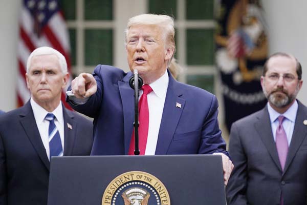 President Donald Trump takes questions during a news conference about the coronavirus in the Rose Garden of the White House on Friday in Washington.