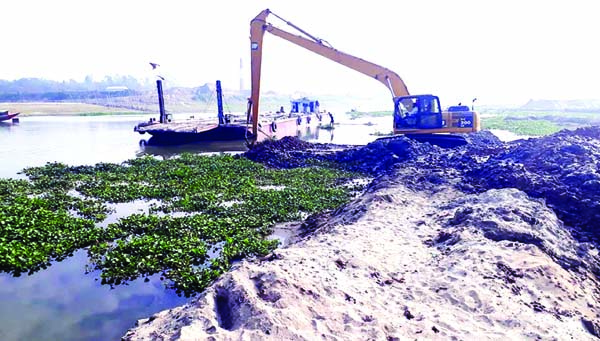 MIRZAPUR (Tangail): The dredging work is going on to recover the navigation of Bangsai River in Mirzapur Upazila . Bangladesh Water Development Board is implementing the project . This snap was taken from Latifpur area yesterday.